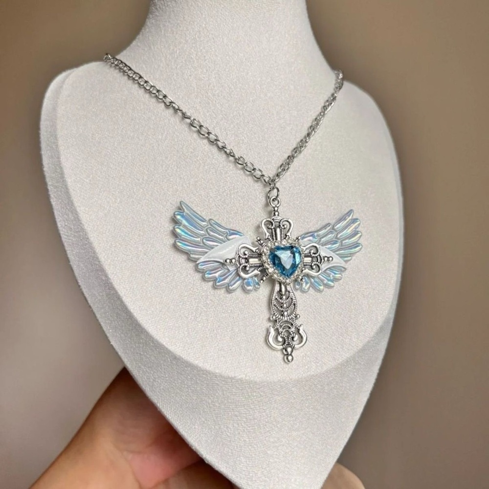 Anthropologie Silver Winged Cross Necklace with Light Blue Heart